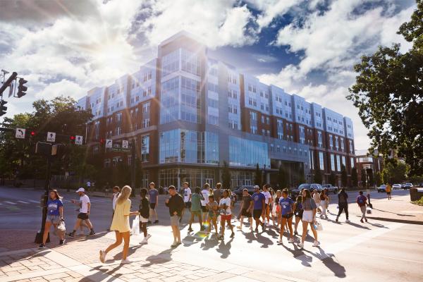 This is a photo of students walking on the University of Kentucky campus. 