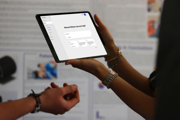 Student holding iPad with CoPilot home page on screen