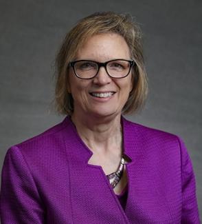 professional headshot of Laura Stephenson wearing a purple blazer